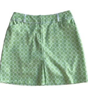 Tail golf skort, skirt w/ attached shorts, lime green & white print. Size 4